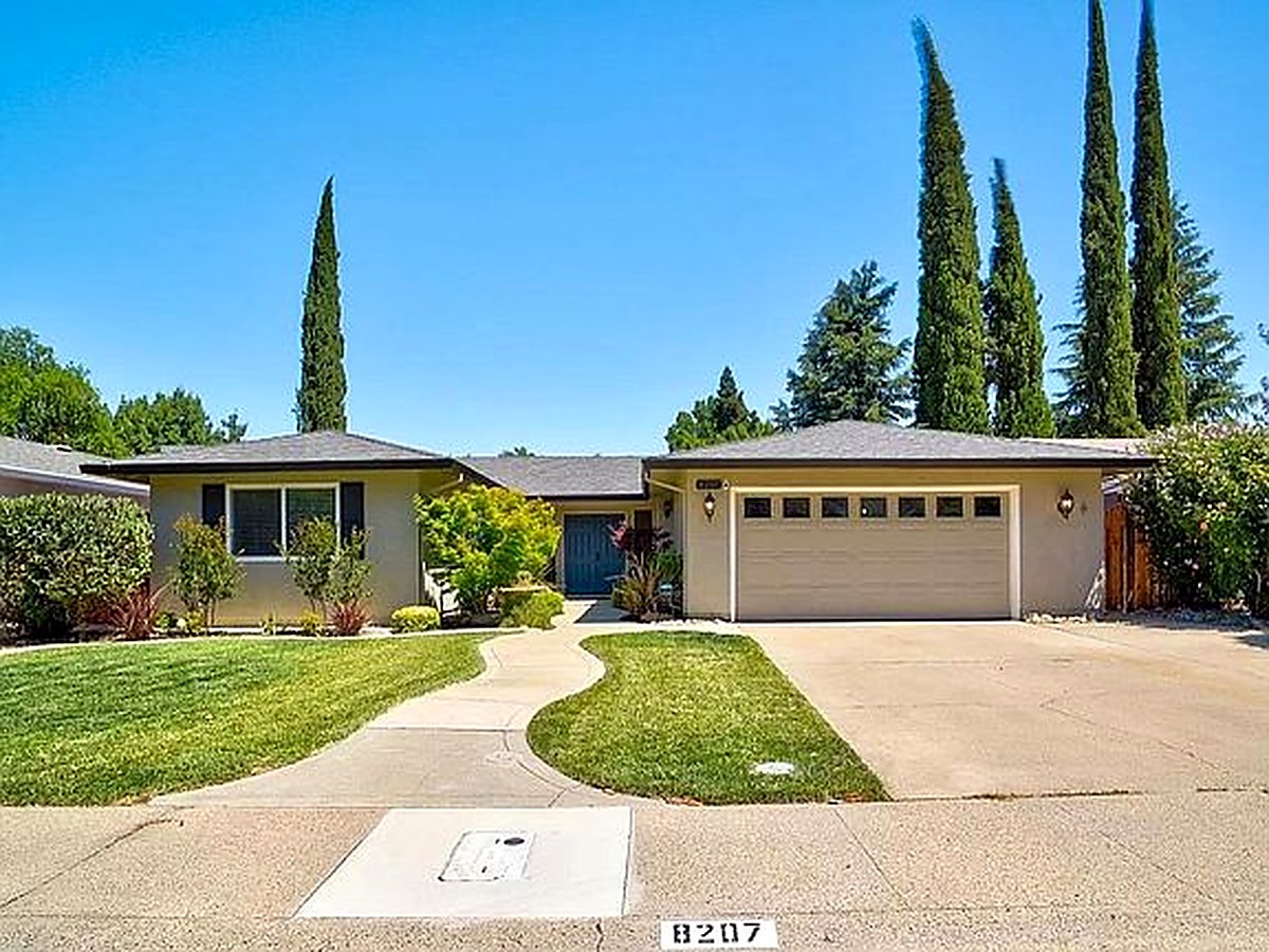 Welcoming front exterior and landscaped entry